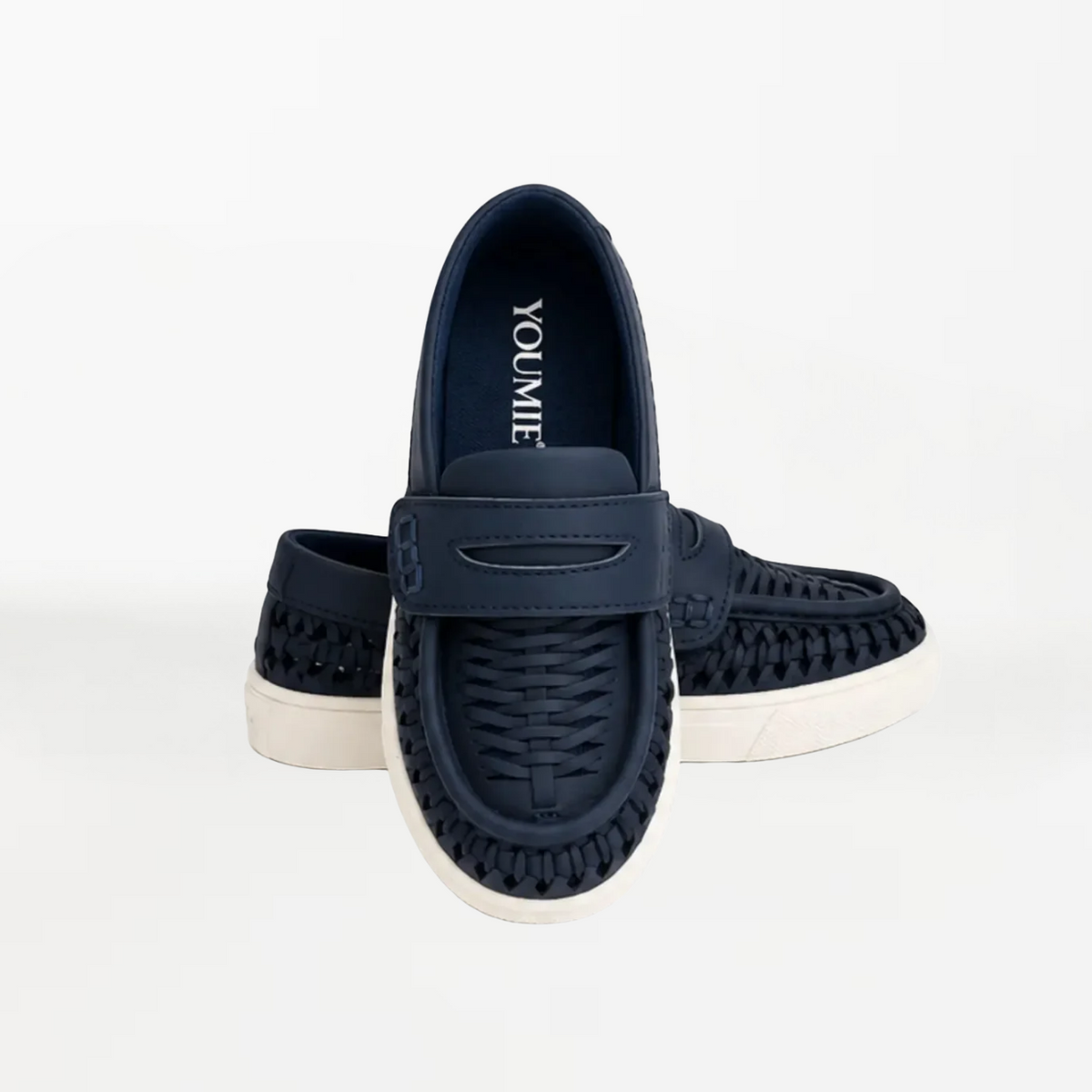 A pair of navy blue slip-on shoes with woven detailing and white soles, displayed against a clean white background. The brand name 'YOU & ME' is visible on the insole of the front shoe.