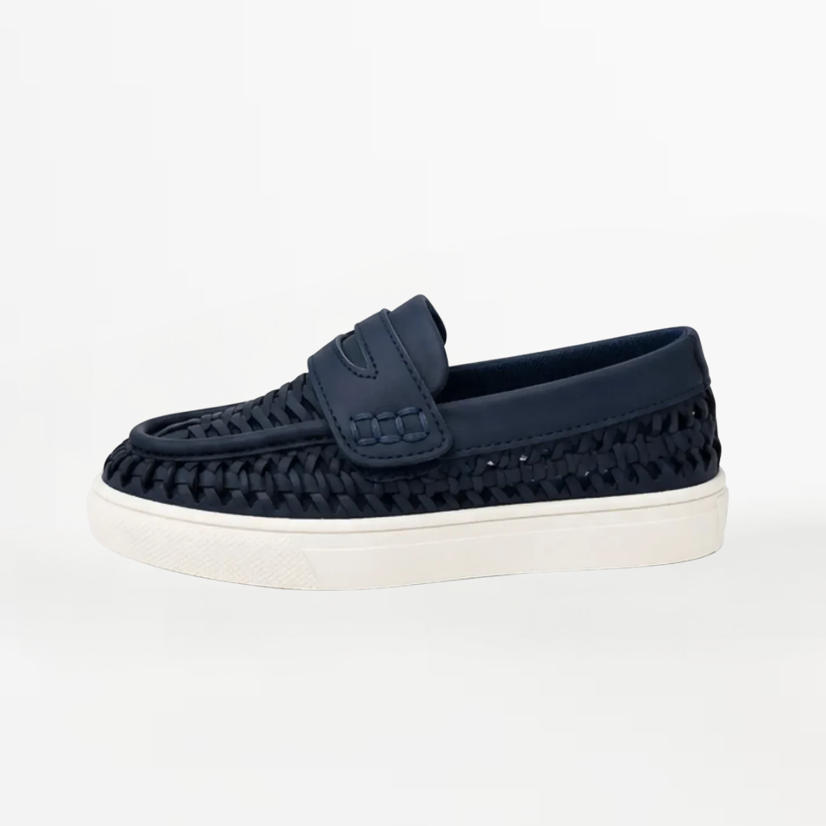 A single navy blue woven slip-on loafer with a thick white platform sole, photographed from the side against a clean white background.