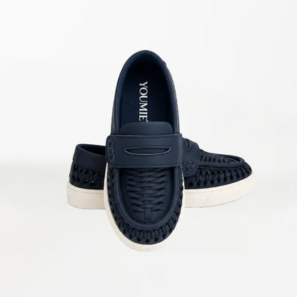 A pair of navy blue slip-on shoes with woven detailing and white soles, displayed against a clean white background. The brand name 'YOU & ME' is visible on the insole of the front shoe.